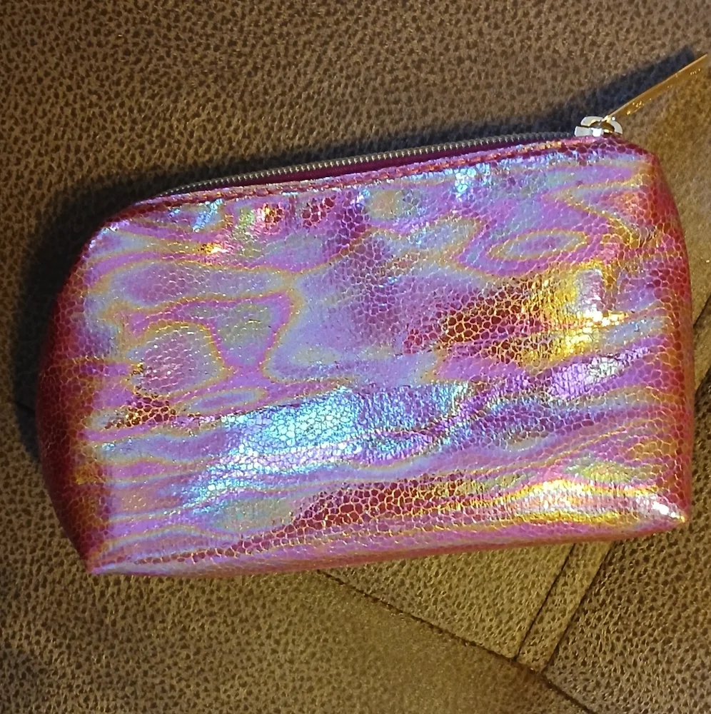 SeneGence pink holographic makeup bag with skin care and gloss samples